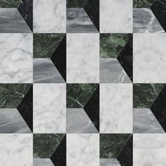 a black and white checkerboard pattern with some green marble on it's sides