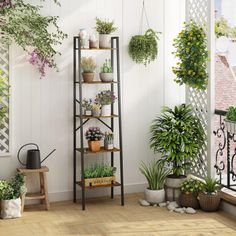 an outdoor room with potted plants on the wall and wooden flooring in front of it