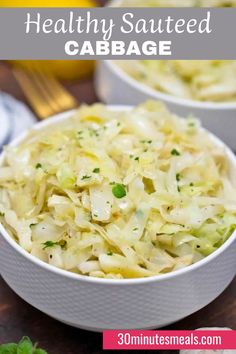 two white bowls filled with coleslaw and garnished with parsley on the side