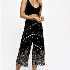 Free People Kas Embellished Wide Leg Pants Black Gold Embroidered Embellished Lace Hem Crop Gorgeous Unlined Hi Waist Side Zipper Crop Pants * Flared Legs Lined To Short Length * Mirror Embellishments New With Tags * Size: Small Retail Price: $198.00 100% Cotton 27" Around Waist 14" Rise 21" Inseam Black Wide Leg Embroidered Bottoms, Party Wide-leg Embroidered Pants, Festive Wide-leg Floral Embroidered Pants, Bohemian Ankle-length Embroidered Pants, Black Bohemian Ankle-length Pants, Linen Ankle Pants, Wide Leg Pants Black, Button Fly Pants, Free People Jumpsuit