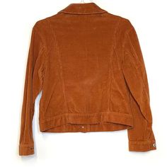 Elevate your casual wardrobe with the Free People Orange Corduroy Jacket, a stunning piece that combines comfort and style effortlessly. This pre-owned jacket, in a vibrant orange hue, features a classic trucker style that is perfect for layering during cooler days. The soft corduroy fabric not only feels luxurious against your skin but also adds a touch of retro charm to any outfit. With its long sleeves and button closure, this jacket is designed for the modern woman who values both fashion an Retro Long Sleeve Denim Jacket For Fall, Classic Orange Outerwear For Spring, Classic Long Sleeve Orange Outerwear, Vintage Orange Outerwear For Fall, Orange Button-up Winter Outerwear, Orange Button-up Outerwear For Winter, Long-sleeved Rust Outerwear For Winter, Casual Fitted Orange Outerwear, Fitted Casual Orange Outerwear