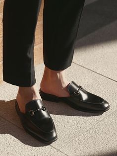 Editor's NotesPASCOROZEN’s loafers give a classic and minimal look with round toe style and flat heel.- Comfortable fit- Backless loafers- Classic design- Round toe style- Flat heel- Logo lettering print in insoleMeasurements(in.)- Size: KR250mm(US7) - KR280mm(US10)- Heel Height: 1.2in.- Fits true to the size*Model Info: 5’10’’ 145.5lbs KR270mm(US9)Composition & Care- (Upper, Lining) Synthetic Leather (Heel) Synthetic Rubber- Please check the care labelDesigner- by PASCOROZEN Timeless Slip-on Loafers With Removable Insole, Flat Slip-ons With Branded Insole For Business Casual, Business Slip-ons With Removable Insole And Flat Heel, Business Casual Flat Loafers With Branded Insole, Formal Round Toe Mules With Textured Sole, Business Slip-on Loafers With Flat Heel, Formal Mules With Textured Sole And Round Toe, Flat Slip-ons With Rubber Sole For Business Casual, Business Mules Slip-on With Flat Heel