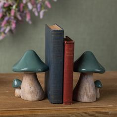 two bookends made out of wood are sitting next to each other on a table