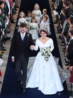 a bride and groom walk down the aisle at their wedding ceremony in london, england