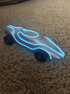 a glowing toy car on the floor