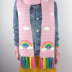 Add some candy-coloured cuteness to even the greyest of winter days with this gorgeous Pastel Rainbow Cloud scarf. Handmade from soft and chunky 100% premium acrylic yarn. The main colour of the scarf is Baby Pink and it features a Pastel Rainbow Cloud motif on each end of the scarf and a white cloud pattern throughout the rest of the scarf. The reverse side of the scarf is plain so it can be worn either way for a different look. The scarf is finished with pastel rainbow coloured tassels in Bubblegum Pink, Daffodil Yellow, Spearmint Green, Turquoise, Lilac. Scarf measures 240cm long and 17cm wide CARE INFORMATIONMachine washable at 30 degrees on gentle cycle. Tumble dry on low or dry flat, naturally.Find the rest of our Cloud Collection HERE Kawaii Winter, Kawaii Crochet, Clouds Pattern, Clouds Design, Rainbow Cloud, Winter Warmers, Bubblegum Pink, Pastel Rainbow, Rainbow Stripes