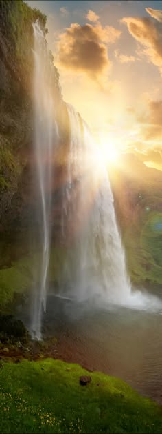 an image of a waterfall with the sun setting behind it