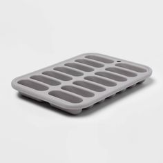 an ice tray is shown on a white surface