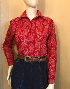 "1960's Adorable Red & White paisley cotton blouse. This is not necessarily a western shirt but I have styled it that way. Classic shirt tail style with pointed collar and button cuffs. Condition - Good Tag - Shirt Accent sz 34 Measurements lying flat- Shoulders 15.5\", Bust 18\", Waist 17\", Length 23\", Sleeves 22.5\"" Fitted Paisley Print Button-up Top, Vintage Long Sleeve Blouse With Paisley Print, Vintage Long Sleeve Paisley Print Blouse, Vintage Paisley Print Button-up Top, Vintage Button-up Top With Paisley Print, Vintage Fitted Paisley Print Tops, Vintage Long Sleeve Paisley Print Top, Vintage Long Sleeve Top With Paisley Print, Retro Long Sleeve Tops With Paisley Print