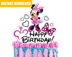 a minnie mouse birthday cake with pink and blue icing on it's top