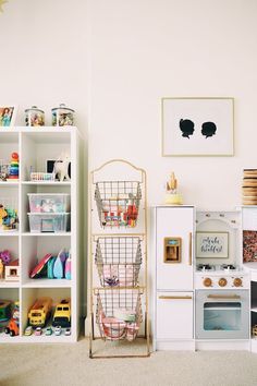 a toy kitchen and play set in a child's room