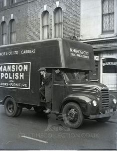 an old black and white photo of a truck