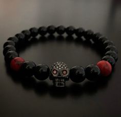 Skull bracelet. All our beads/ stones are carefully selected individually to give you the best quality Please select your wrist size and we will ensure to achieve the best fit for you.  In order to obtain superior strength, we then use silicon stretch cord.  Your bracelets will come in a black leather pouch Adjustable Skull Bracelet As Gift, Adjustable Skull Bracelets As Gift, Adjustable Skull Wristband Gift, Handmade Skull Bracelet As A Gift, Handmade Black Skull Bracelets, Handmade Black Skull Bracelet, Skull Shaped 8mm Bead Jewelry Gift, Bracelet Gift Ideas, Gift Ideas Anniversary