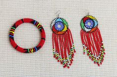 African Beaded jewelry set, Beaded bracelets, Zulu Beaded bracelets, Beaded jewelry for women, Dangle earrings, Christmas gift for her The African beaded jewelry set are handmade in Kenya. They are beautiful and can compliment any outfit. * color: red * Bracelet Circumference: 8 inches  * Can fit a standard wrist size of 7.5 inches.    If you have a larger wrist, please let us know on the note to seller section while making your purchase. *Price is for all bracelet and earrings shown in picture Shipping fee is for the first item only. Other items ship for FREE! Shipping via DHL Express that takes 3-5 days to be delivered. To view more items from our shop, kindly click here: nkoroicrafts.etsy.com Thank you for visiting! Blue Beaded Necklace, Red Bracelets, Zulu, African Beads, African Jewelry, Wedding Jewelry Sets, Christmas Gifts For Her, Fashion Earrings, Jewelry Set