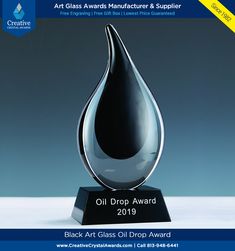 an award is displayed on a table for the art glass awards manufacture & supply company