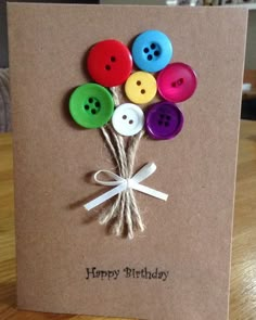 a birthday card with buttons on it