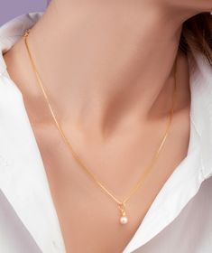 This freshwater pearl gold necklace is the epitome of timeless elegance. The necklace features a delicate chain made of high-quality gold, expertly crafted to provide durability and longevity. The centerpiece of the necklace is a stunning freshwater pearl, which shimmers with every movement. The freshwater pearl is carefully selected for its luster and beauty, making each necklace unique. The pearl is expertly set in high-quality gold, ensuring that it remains secure and safe. The delicate chain Yellow Gold Charm Necklace With Pearl Drop, Gold Plated Yellow Gold Pearl Drop Necklace, Classic Gold-plated Pearl Necklace, Elegant Gold Charm Necklaces For Formal Occasions, Delicate Gold Akoya Pearl Necklace, Delicate Akoya Pearl Gold Necklace, Delicate Akoya Pearl Necklace With Delicate Chain, Delicate Akoya Pearl Clavicle Chain Necklace, Delicate Akoya Pearl Clavicle Necklace