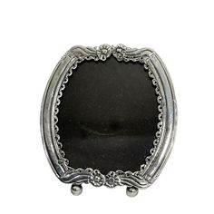 Dutch 19th century small silver photo frame A Dutch small standing silver photo frame in mirror image 19th Century. Dutch silver photo frame on ball feet. The photo frame can be placed as standing, but also has an eyelet to hang it up Many existing silver objects, such as a cap closure or a bracket with an embroidered sac (money purse) were later made into a photo frame. It is 833/1000 silver purity. Dutch hallmarked, but has faded from use and polishing over the years. The Dutch Silversmith's m Silver Objects, Money Purse, Mirror Image, Silver Frame, Delft, Photo Frames, Photo Frame, 19th Century, A Photo