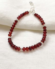 Faceted garnet beads sparkle within this bracelet, complemented by sterling silver components. Let January's birthstone brighten your look. Bracelet length: 7 inches plus 1-inch extender Materials: 4 mm garnet beads, sterling silver Cheap Red Beaded Bracelet With 108 Beads, Elegant Sterling Silver Beaded Bracelets With Gemstone, Elegant Sterling Silver Bracelets With Faceted Beads, Faceted Garnet Round Bead Jewelry, Elegant Sterling Silver Crystal Bracelet With Faceted Beads, Sterling Silver Beaded Bracelets With Faceted Beads For Everyday, Classic Faceted Bracelets As Gifts, Elegant Sterling Silver Beaded Bracelet With Faceted Beads, Faceted Sterling Silver Beaded Bracelets For Jewelry Making