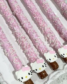 hello kitty cake pops are arranged on a plate