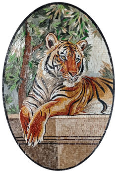 a tiger sitting on top of a stone wall next to a tree with leaves and branches