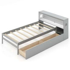 the bed frame is made up and has two drawers underneath it, with one drawer open