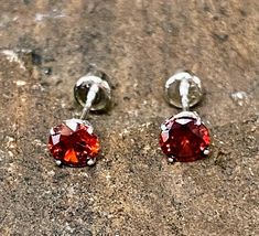 Lovely 14K Yellow Gold Round 0.42TCW Garnet Stud Earrings w/ Screw Back Closure Metal Purity: 14K Metal Type: Yellow Gold Main Stone: Garnet Stone Size/Carats: 4mm round/ 0.42TCW Weight: 0.41g Closure Type: Screw Back F1832 Prompt Shipping Easy Returns Red Round Earrings With Prong Setting, Red Birthstone Round Earrings, Red Birthstone Earrings For Anniversary, Anniversary Red Birthstone Earrings, San Jacinto, Garnet Stone, Red Garnet, 2 Carat, Jewelry Earrings Studs