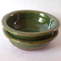 three green bowls stacked on top of each other