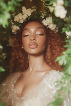 a woman with long red hair wearing a white dress and flowers in her hair is looking into the distance