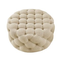 the foot stool is made out of linen and has buttons on each side, which are attached