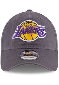 This Los Angeles Lakers Grey Adjustable Hat features a front embroidered team logo on a lightly-structured cotton crown, with pre-curved visor and adjustable backstrap. Team logo embroidered on the front, Cloth Strap Closure to dial in the perfect fit, Relaxed, unstructured fit, Pre-curved bill, 100% cotton construction, New Era Flag logo on side, Dad hat, 100% Cotton, Washable, Imported Team-colored Cotton Hats With Curved Brim, Sporty Cotton Hats For Fan Merchandise, Collegiate Cotton Hat With Embroidered Logo, Casual Cotton Hats For Fan Gear, Team-colored Cotton Baseball Cap For Sports, Collegiate Cotton Hats For Sports Events, Cotton Hat With Team Logo For Sports Events, Team-colored Cotton Hat With Embroidered Logo, Game Day Cotton Hat With Embroidered Logo