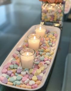 two trays filled with marshmallows and candles