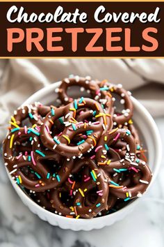 chocolate covered pretzels in a white bowl with sprinkles on top