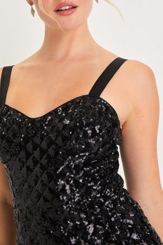 You'll radiate with undeniable glamour when you strut in wearing the Lulus Alluring Glow Black Sequin Sleeveless Bustier Romper! Glittery black sequins create an ultra-subtle diamond pattern across this impressive romper that features a bustier-style bodice with seamed cups and a flirty sweetheart neckline, supported by stretchy elastic tank straps. The fitted waist tops a pair of cute shorts that will perfectly show off your favorite pair of heels! Hidden back zipper/clasp. Fit: This garment fi Glamorous Sleeveless Sequin Dress With Corset Back, Glamorous Sequin Dress With Corset Back For Party Season, Sleeveless Sequin Dress With Corset Back For Night Out, Sleeveless Sequin Dress With Fitted Bodice For Party, Strapless Evening Tank Top With Built-in Bra, Glamorous Fitted Sequin Dress With Corset Back, Sleeveless Sequin Dress With Corset Back For Party Season, Fitted Sleeveless Sequin Dress With Corset Back, Strapless Sequined Corset For Prom