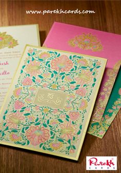 wedding cards in pink and green with gold foil on the front, side and back