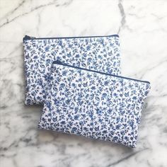 These zipper pouches are perfect for anyone who needs a little organization in their life! Use it as a cord catcher, make up bag, pencil case, mini emergency kit, or anything you can imagine! The options are endless!This pouch comes lined with gray Kona fabric and a navy YKK zipper. This pouch is sewn with a layer of interfacing for added stability. Pouch measures approximately 5.5" x 8"Please note that all of our items are handmade and will vary slightly. Colors may vary slightly based on your Navy Makeup, Mini Emergency Kit, School Pouch, Canvas Pencil Case, Fog Blue, Card Pouch, Zipper Pouches, Cute Pens, Blue Purse