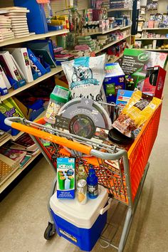 a shopping cart filled with items in a store