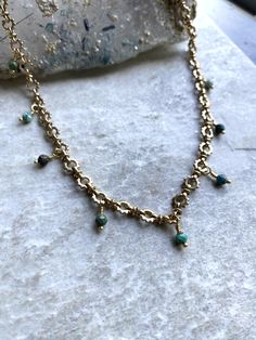 Brass wire, chain, clasp, and african turquoise beads.  The necklace measures 14-16' long. ~Visit our new shop Free Spirit Rox for beautiful collectible crystals, gemstones, and mineral specimens! https://www.etsy.com/shop/FreeSpiritRox Bohemian Gold Emerald Necklace With Gemstone Beads, Bohemian Style Gold Emerald Necklace With Round Beads, Bohemian Gold Emerald Necklace With Round Beads, Artisan Gold Chrysocolla Jewelry, Green Jewelry With Round Beads And Adjustable Chain, Green Jewelry With Adjustable Chain And Round Beads, Bohemian Emerald Gemstone Necklaces, Artisan Turquoise Necklace With Natural Stones In Gold, Green Beaded Chain Necklace For Jewelry Making