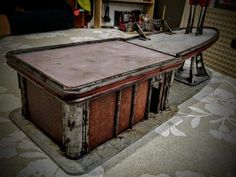 an old table that has been turned into a desk