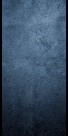 a dark blue background with some stains on it