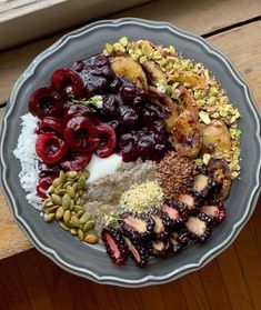 a plate filled with different types of food on top of a wooden table