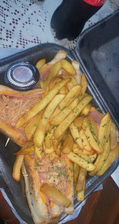 a sandwich and french fries on a tray