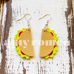 a pair of earrings that are shaped like a hamburger