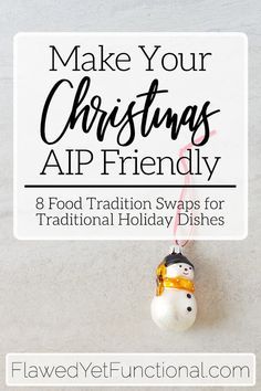 a snowman ornament hanging from a sign that says make your christmas app friendly