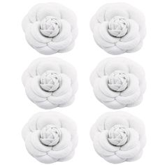 six white flower appliques on top of each other in the shape of a rose