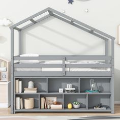 a gray bunk bed with bookshelf underneath it in a child's room