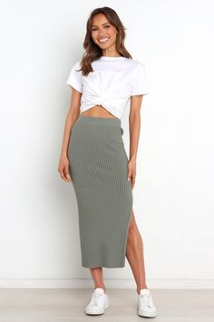 DETAILS Make a fashion statement in this must-have midi-length skirt! Crafted from stretch ribbed knit for an easy fit, its elasticised waistband ensures maximum comfort and style. With a side split feature to show off your legs, you'll be sure to turn heads when you wear it.  midi length  elasticised waist stretch ribbed knit side split feature soft feel  unlined   material - 70% viscose / 30% nylon           SIZING  model is 5' 8" and wears a Size 2 model stats: bust - 34", waist - 25", hips - 37"              GARMENT CARE  cold hand wash separately Petal And Pup, Ribbed Skirt, Midi Dress Formal, Long Sleeve Sweater Dress, Dresses By Length, Mode Inspo