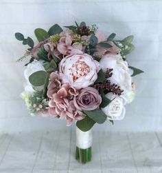 a bridal bouquet with pink and white flowers