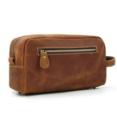 This leather toiletry bag is made of genuine cowhide leather, Every seam is reinforced and the zippers are heavy-duty, with strong zipper pulls that will last for years without breaking off or splitting in this dopp kit for men.     ITEM FEATURES  - 1 x Main Compartment - 1 x Interior Zipper Pocket - 2 x Slot Pockets - 1 x Back Zipper Pocket - 5 x Bottom Rivets - Genuine Leather & Durable - Side Handle Design      ITEM DETAILS  *Item Type: Toiletry Bag *Material: Crazy Horse Leather *Size: L26 *W11 *H15(CM) *Color: Brown /Dark Brown/ Black/ Wine Red *Closure Type: Zipper *Style: Vintage    CARE INSTRUCTIONS  * Our products are designed to last a lifetime  Natural Leather creams and waxes are the way to go! Avoid chemicals or sprays. I recommend.    WE OFTEN GET ASKED WHAT IS CRAZY HORSE? Brown Leather Pouch With Large Capacity, Large Capacity Leather Travel Cosmetic Bag, Large Capacity Leather Travel Pouch, Leather Travel Cosmetic Bag With Zipper Pocket, Leather Travel Pouch With Zipper Closure, Leather Pouch With Zipper Pocket For Daily Use, Leather Cosmetic Bag With Zipper Pocket For Travel, Leather Business Pouch With Zipper Closure, Business Leather Pouch With Zipper Closure