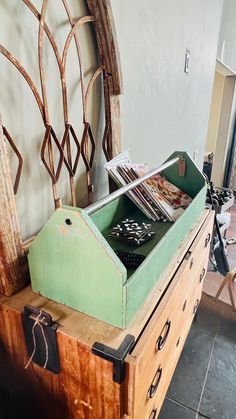 an old wooden chest with magazines in it